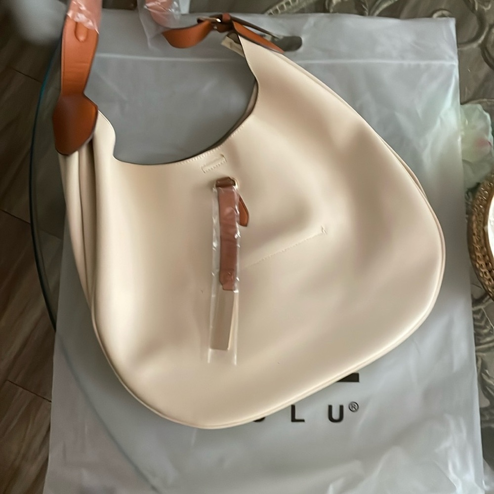 brand new Loulu bag have not been used, made from a cow skin,cream color
